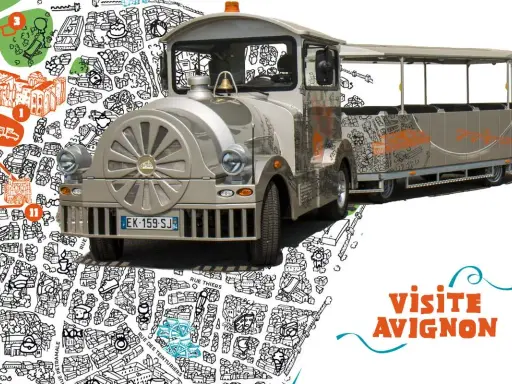 Le petit train touristique de Avignon, décoré de dessins de la ville, prêt à emmener les visiteurs découvrir les trésors d'Avignon.